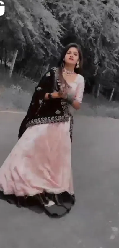 Woman in traditional attire on a forest road for wallpaper.