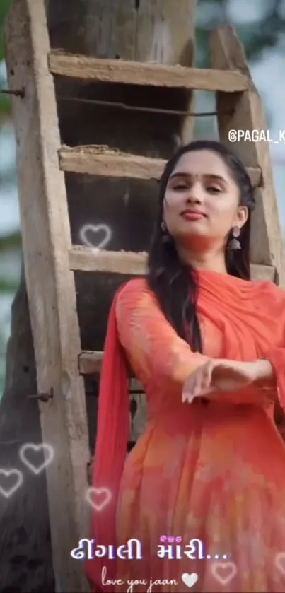 Woman in orange dress posing by a ladder outdoors.