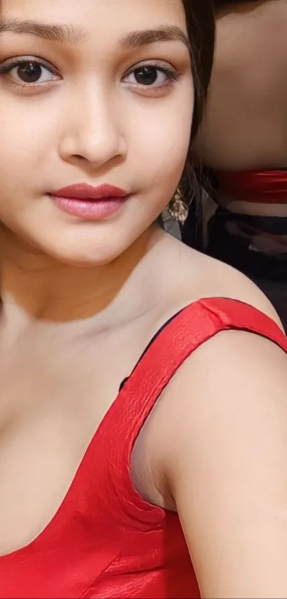 Elegant woman in a vibrant red dress as mobile wallpaper.