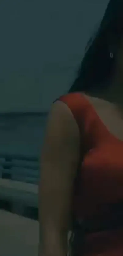 Woman in a red dress by the sea.