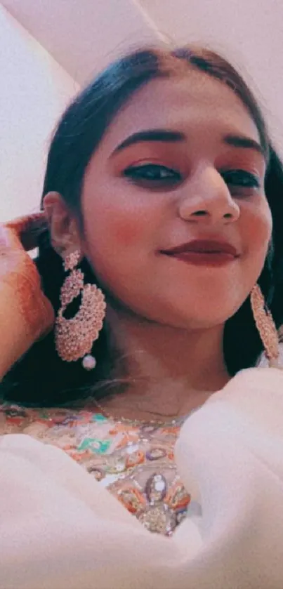 Woman in elegant traditional attire with intricate jewelry.
