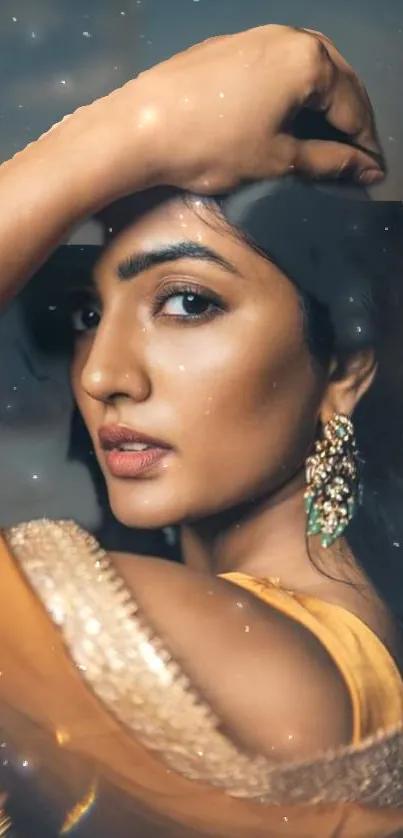 Elegant woman in yellow saree with ornate earrings.