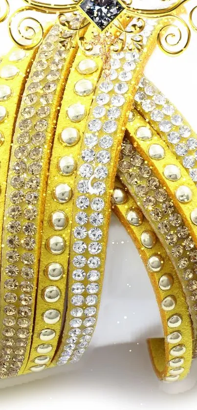 Elegant yellow bands with sparkling jewels on a mobile wallpaper.