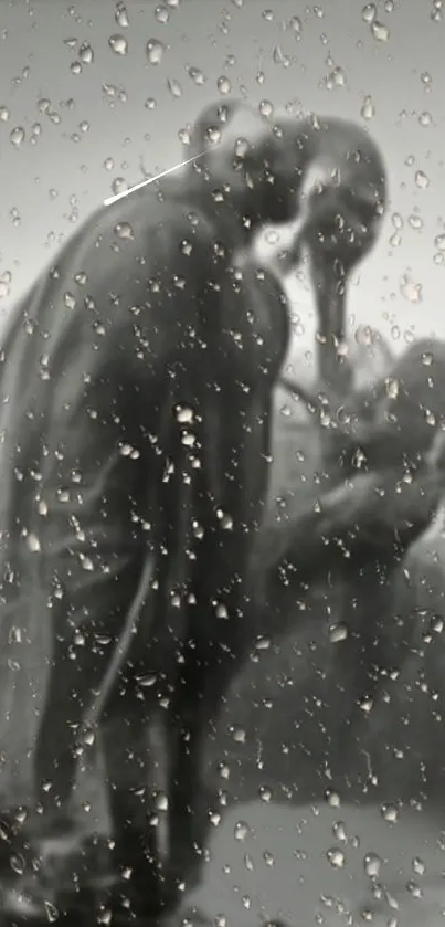 Elephant silhouettes through raindrops on glass, with a soft gray background.