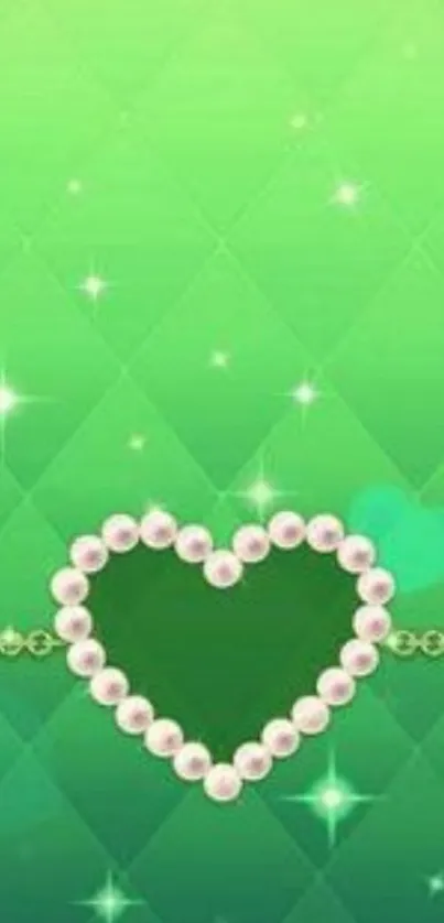 Emerald heart with pearls and sparkles on green background.