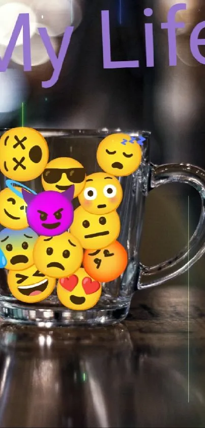 Mug filled with colorful emojis, labeled 'My Life', on a wooden table.