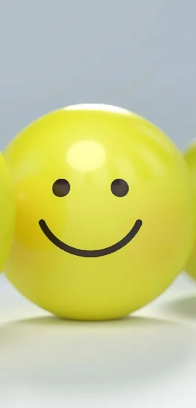 Four expressive yellow emoticons display a range of emotions on a light background.