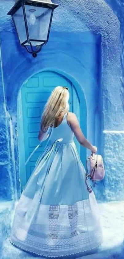 Woman in blue dress at blue doorway wallpaper.