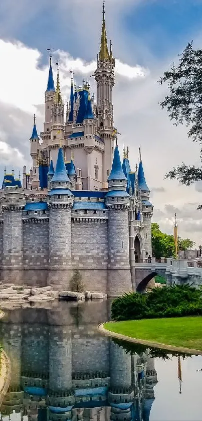 Majestic castle beside a serene moat under a bright blue sky.