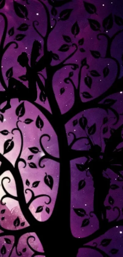 Silhouetted fairies on a tree with a purple starry background.