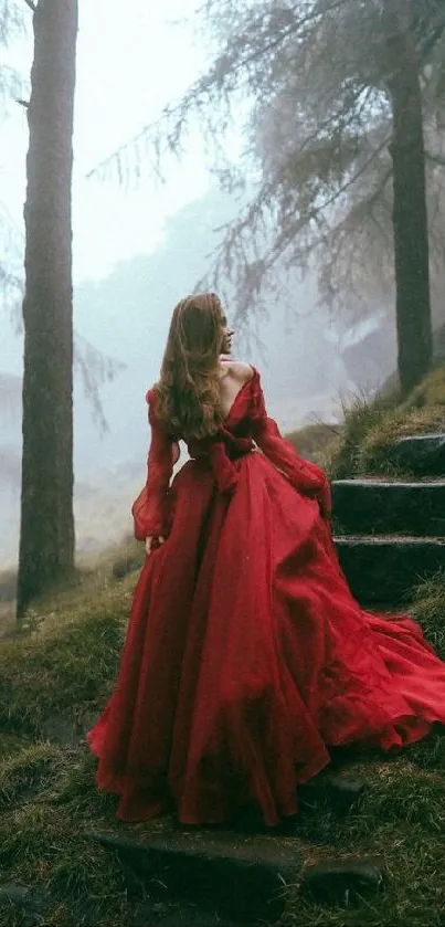 Woman in red dress walking through a misty forest path.