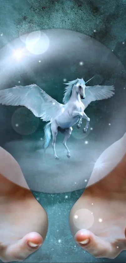 Mystical scene with pegasus inside a crystal ball held by hands against dark blue.