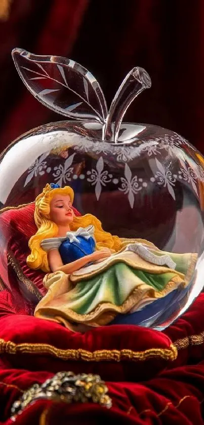 Sleeping Beauty in a glass apple on a red cushion.