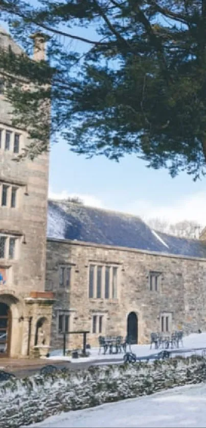 Winter view of Boringdon Hall Hotel with snow-covered grounds and stone architecture.