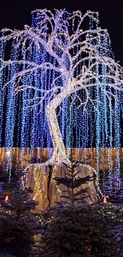 Stunning blue-lit tree at night with a mystical glow.