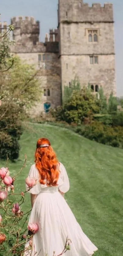 Woman in white dress walking toward a stone castle surrounded by lush greenery and flowers.