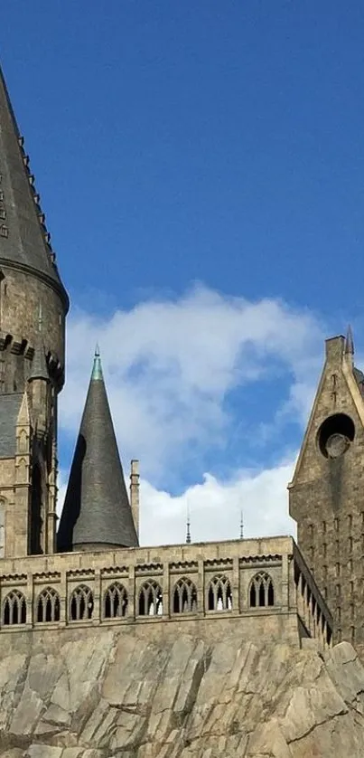 Castle towers against a bright blue sky in fantasy wallpaper.