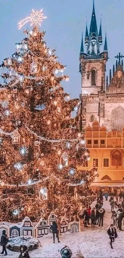 Festive Christmas market with lit tree and historical backdrop.