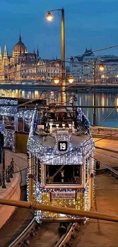 Lit tram on city tracks with scenic night skyline.