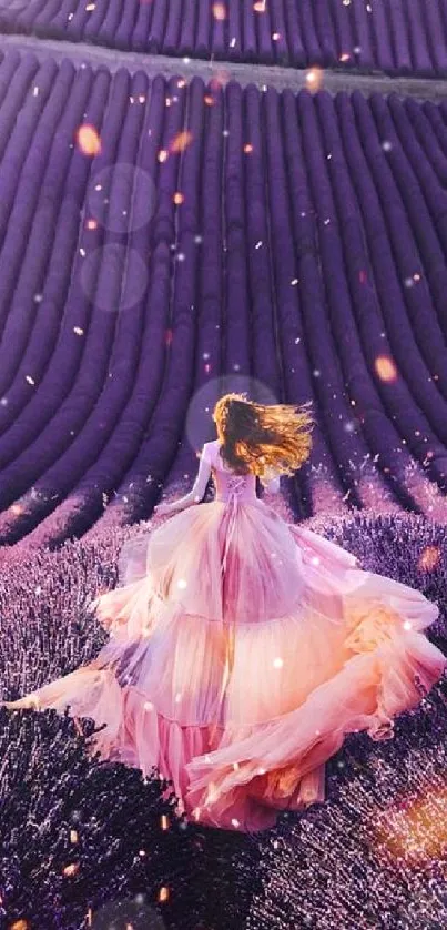 Lavender field with woman in flowing pink dress surrounded by purple flowers.