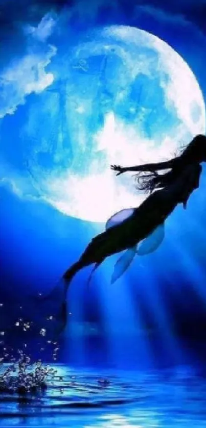 Silhouetted mermaid leaps in front of a full moon over blue ocean waves.