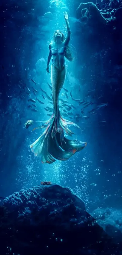 Mystical mermaid underwater in deep blue ocean scene.