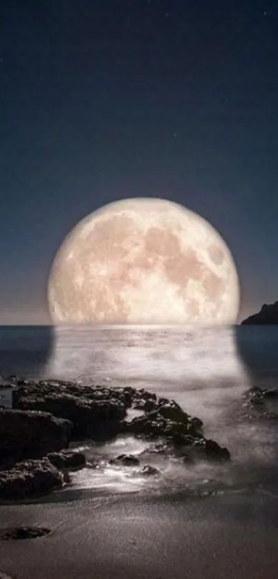 Moon rising over calm ocean at night.