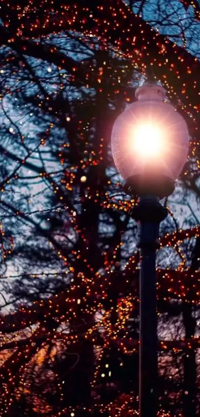 A glowing street lamp with sparkling lights in a nighttime setting.