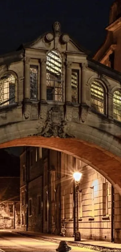 Night view of Oxford's historic bridge and alleyway.