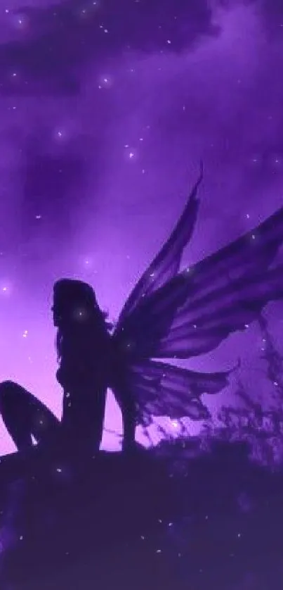 A silhouette of a fairy with wings against a purple backdrop.