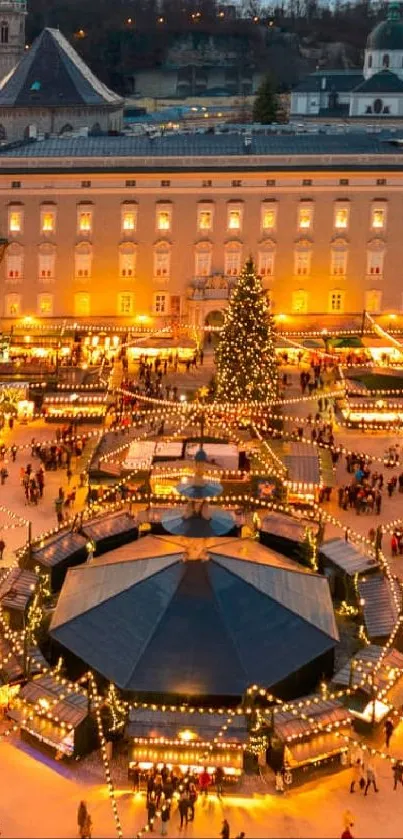 Aerial view of Salzburg Christmas market illuminated by warm festive lights.