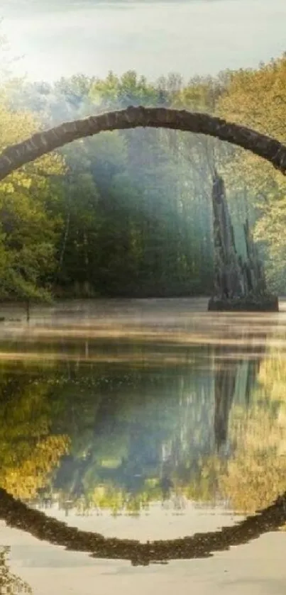 Stone bridge reflecting in calm river surrounded by greenery, tranquil scene.