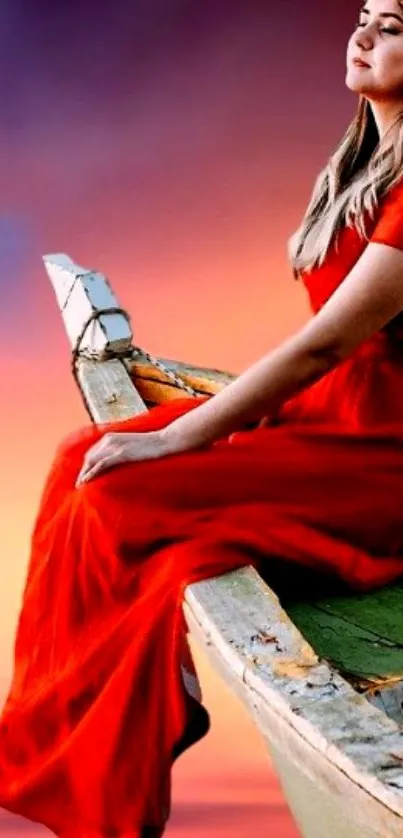 Woman in red dress sits on a boat against a vibrant sunset sky.