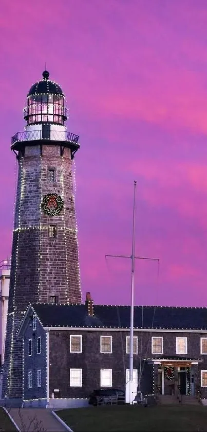 Lighthouse against a pink and purple sunset sky, perfect for mobile wallpaper.