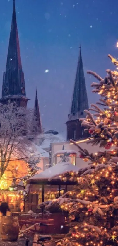 Snowy village with Christmas lights and spires at night.