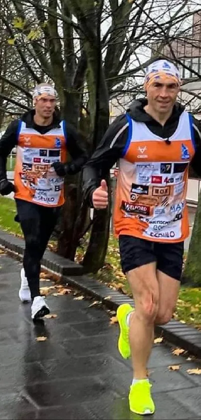 Runners in vibrant gear during autumn run.