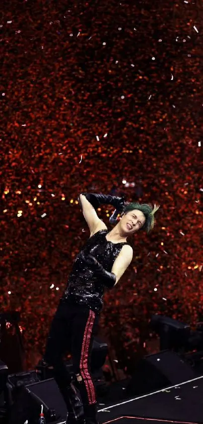 Energetic performer on stage with confetti backdrop in a lively concert setting.