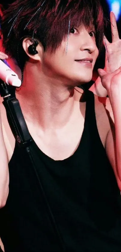 Energetic performer on stage during a concert.