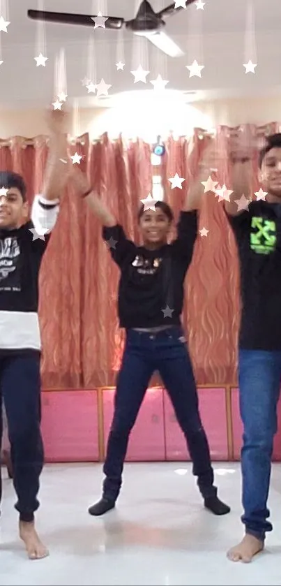 Three young people dancing energetically with star effects in a warm, indoor setting.