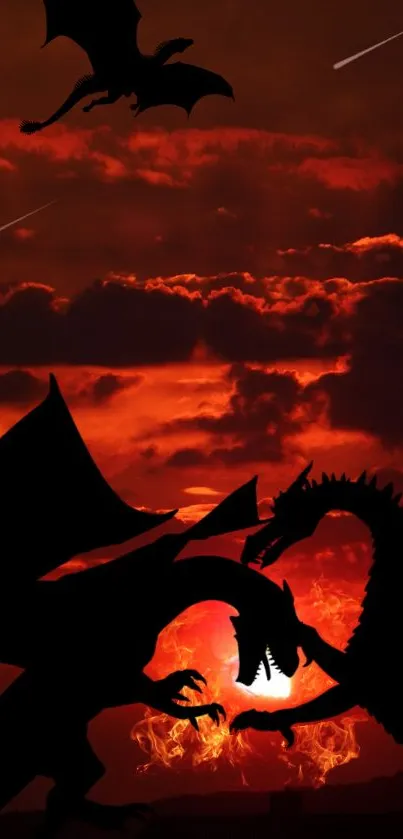 Silhouetted dragons battle against a fiery red sunset background.