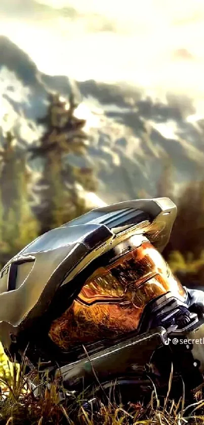 Futuristic helmet on grassy landscape with mountains in background.