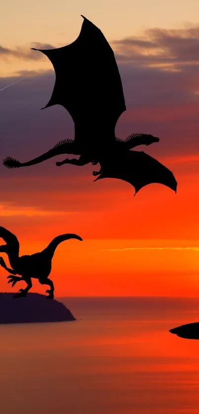 Silhouetted dragon and dinosaur at sunset.