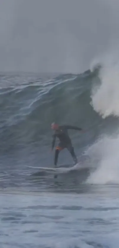 Surfer tackling a monstrous wave, captured mid-action.