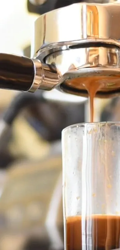 Close-up of espresso machine brewing coffee into a glass.