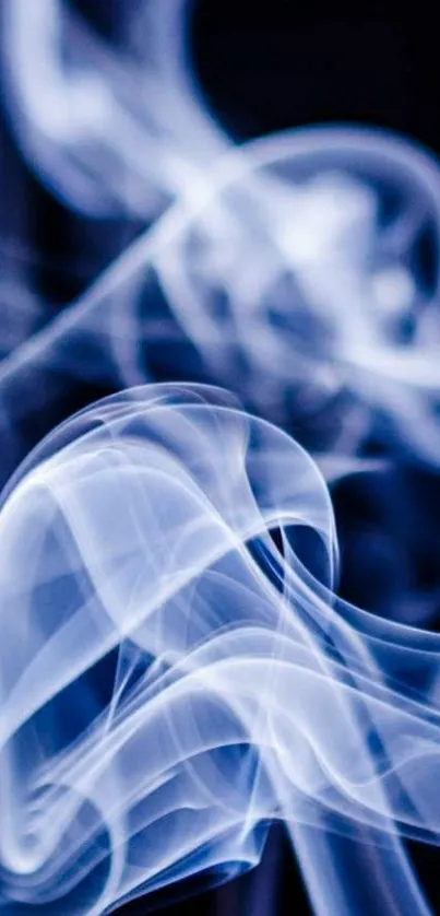 Ethereal blue smoke swirling on dark background.