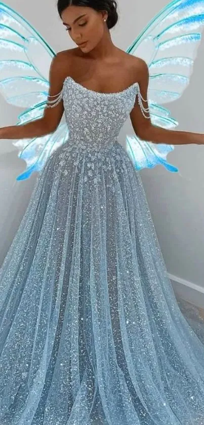 Woman in a sparkling blue gown with fairy wings.