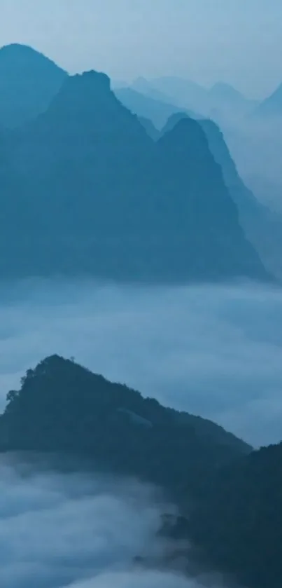 Ethereal blue mountains with misty fog covering the valleys.