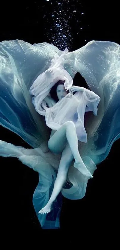 Ethereal figure in flowing fabric against a black background.