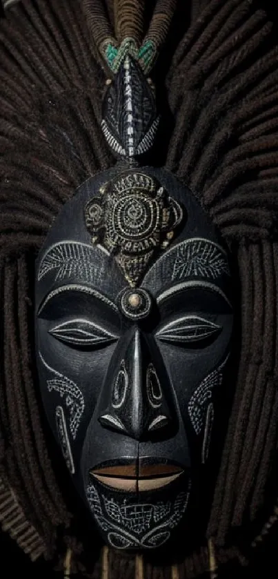 Intricate ethnic mask on dark background, showcasing cultural design.