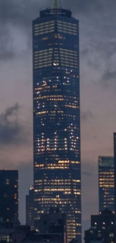 Luminous skyscraper against a dark city skyline in the evening.